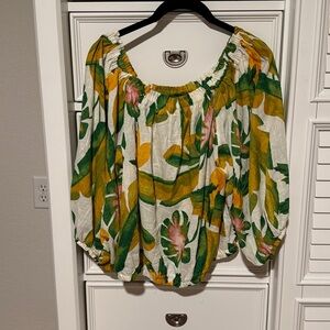 Panama Jack Green and Yellow  with splashes of pink on an off white background.